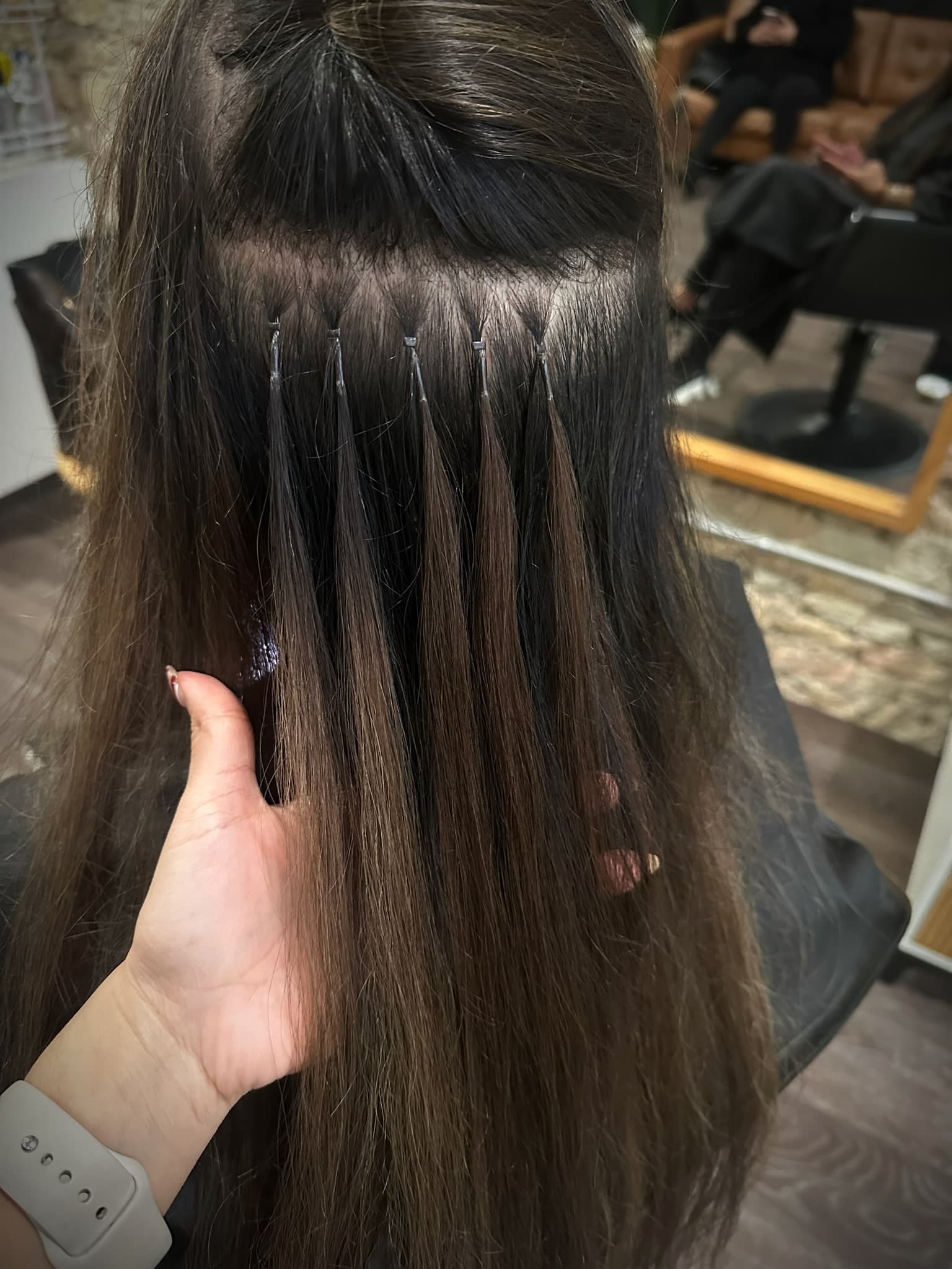 Detail of K-tip extension rows installed close to the scalp