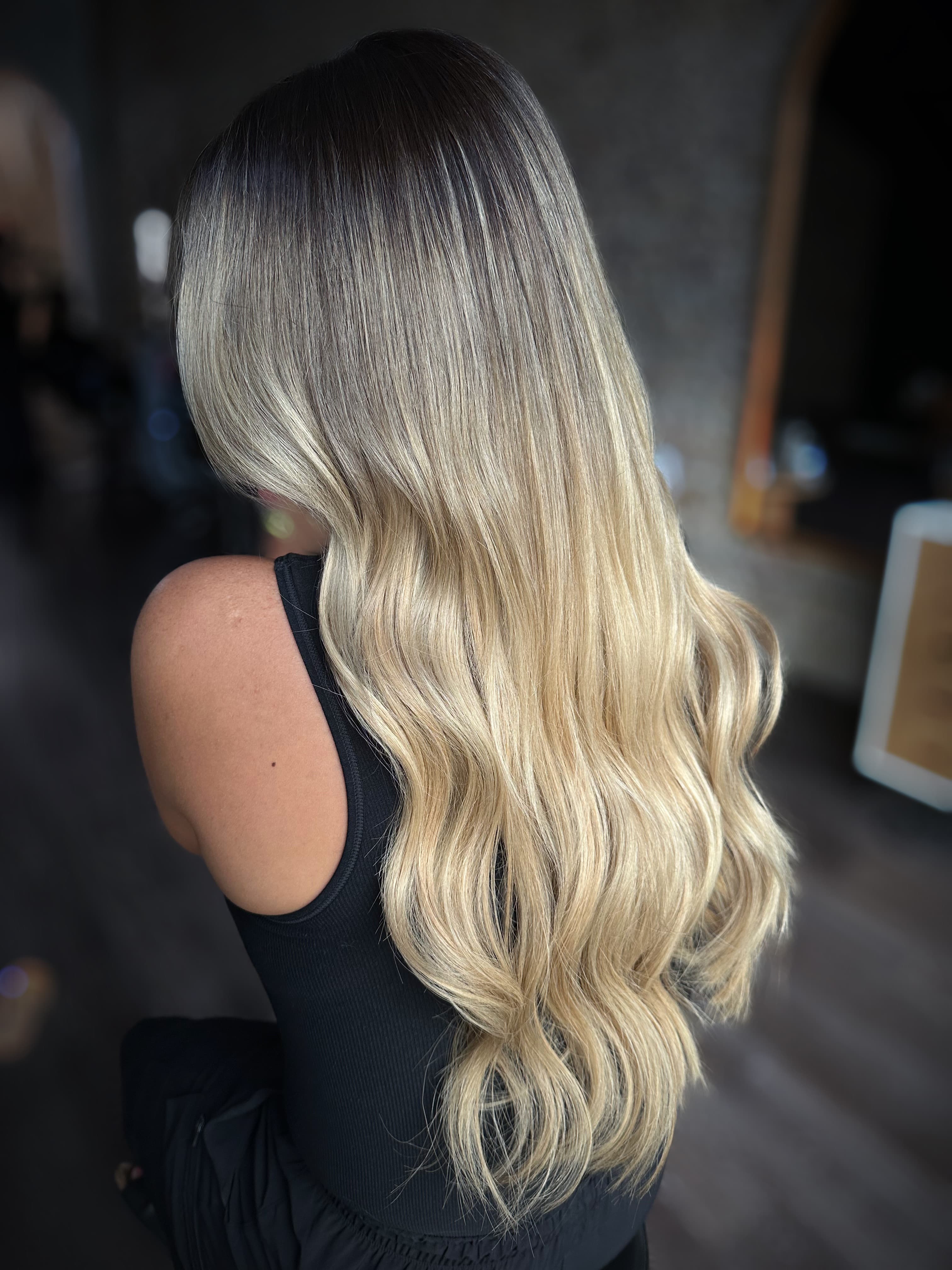 Long blonde waves with seamless extensions